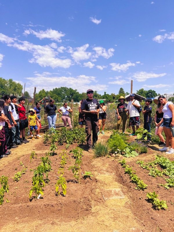 CCFC youth and families on a tour of a community garden